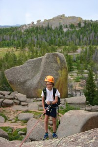 Adam BRINK’S client max caplan, 9, on his first rappel in vedauwoo, wyo. Photo by adam brink, AMGA Rock Instructor, AMGA SPI