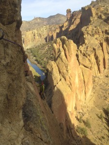 Peter Keene (instructor) follows a traverse pitch on Sky Ridge (5.8 R) with the Monkey Face visible in the background.