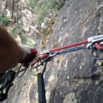 A pre-rigged rappel, one of the common ways of rappelling with clients. The guide can set up and safety check the system before descending to the next anchor, and then provide a fireman’s backup from there.
