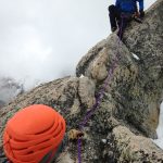 Josh Jackson belays in Ron Paproski toward the summit of Disappointment Peak