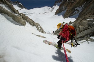 Caroline Gleich rappeling a pitch of ice at the bottom of the Y Couloir on the Aiguille de Argentiere in the French Alps.