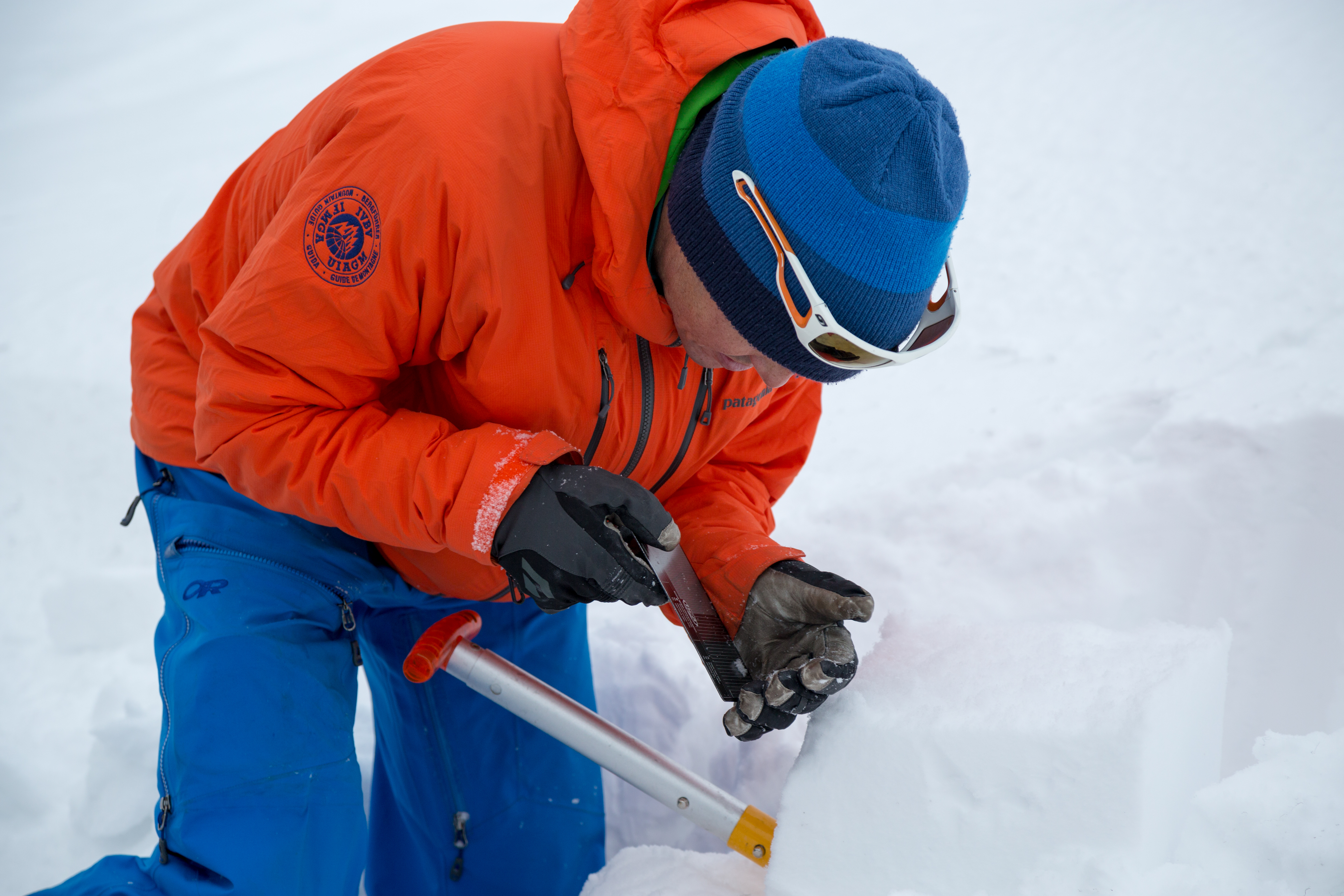 AMGA instructor Jeff Ward looking at snow crystals.